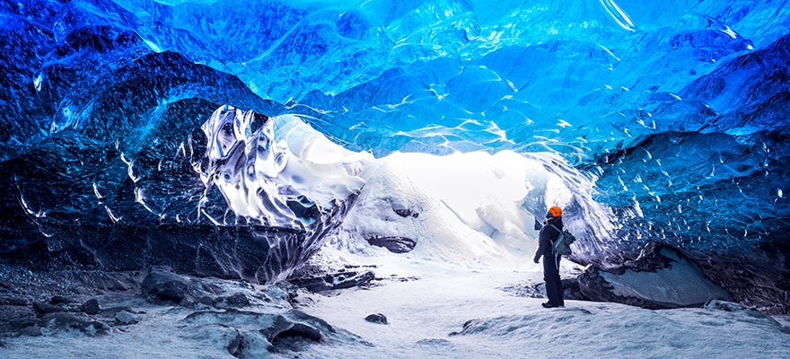 Traveller Visiting Ice Cave With Amazing Eye-catching Scenes
